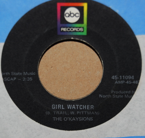 OKAYSIONS — GIRL WATCHER / DEAL ME IN record label scan