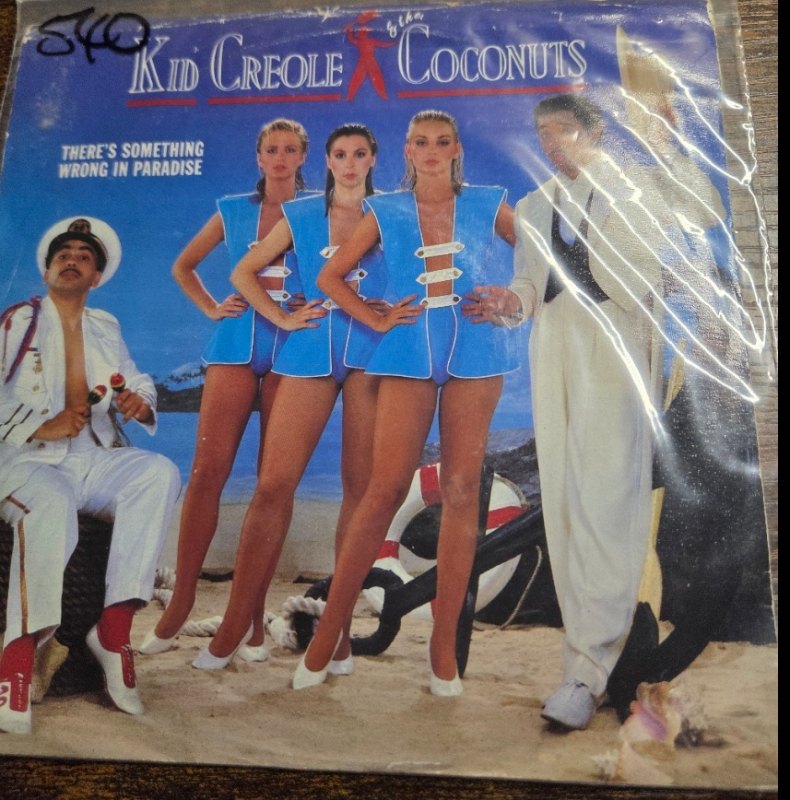 KID CREOLE AND THE COCONUTS — THERE'S SOMETHING WRONG IN PARADISE / FIRESIDE STORY record label scan