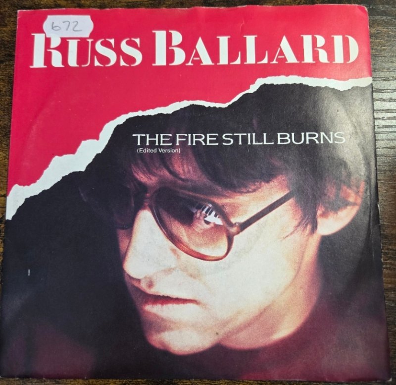 RUSS BALLARD — THE FIRE STILL BURNS / HOLD ON record label scan