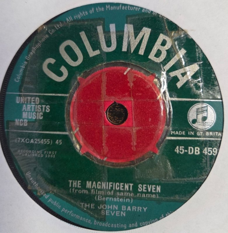 THE JOHN BARRY SEVEN — THE MAGNIFICENT SEVEN / SKID ROW record label scan