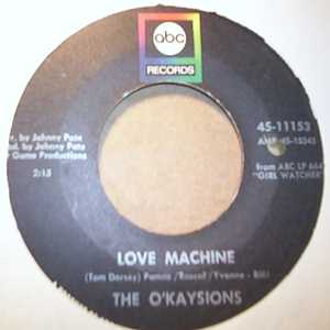 OKAYSIONS — LOVE MACHINE / DEDICATED TO THE ONE I LOVE record label scan