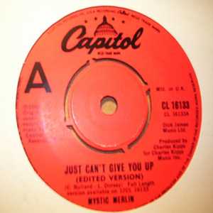 MYSTIC MERLIN — JUST CAN'T GIVE YOU UP / BURNED TO LEARN record label scan